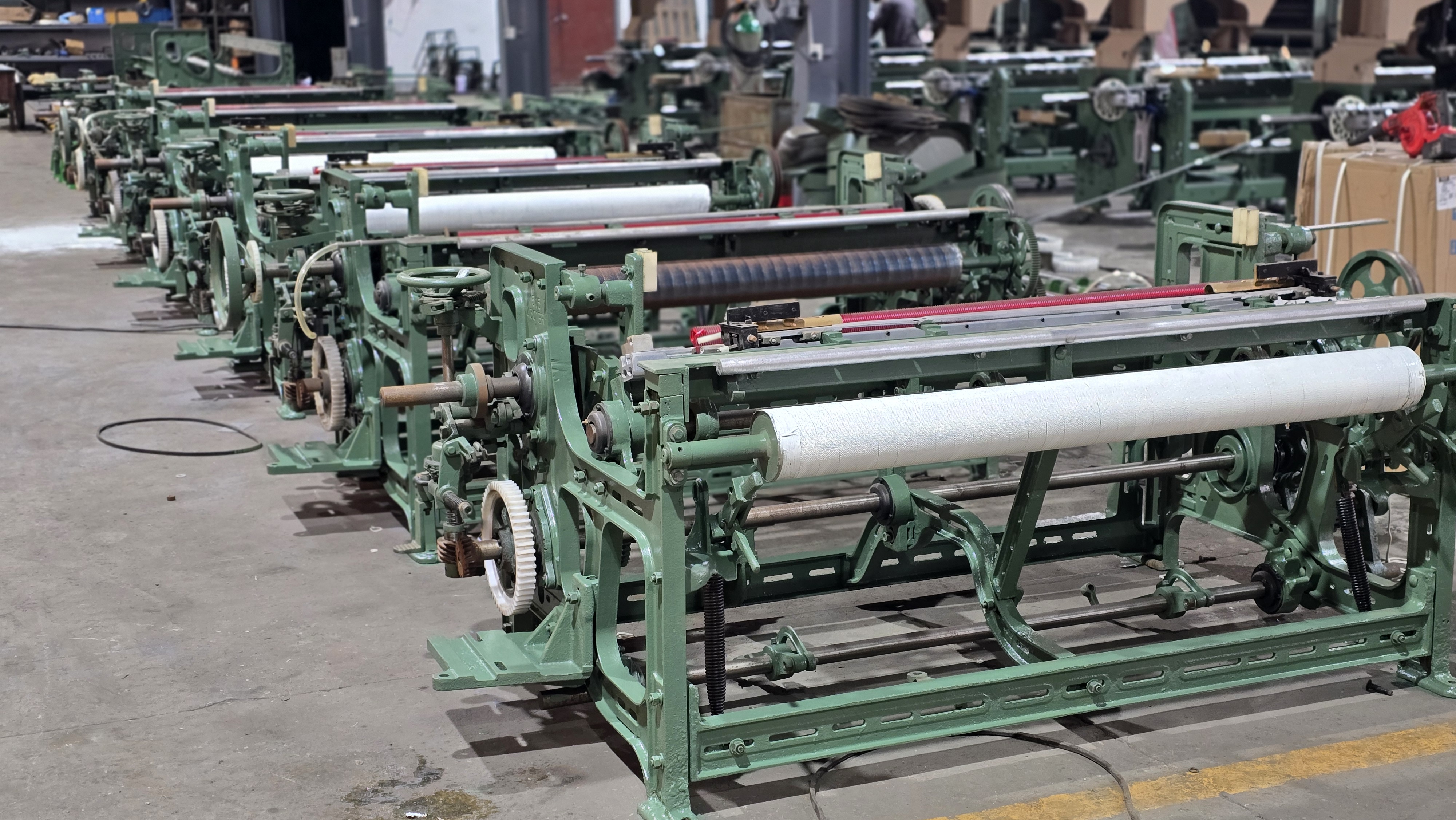 MG768 looms arranged in a factory workshop row