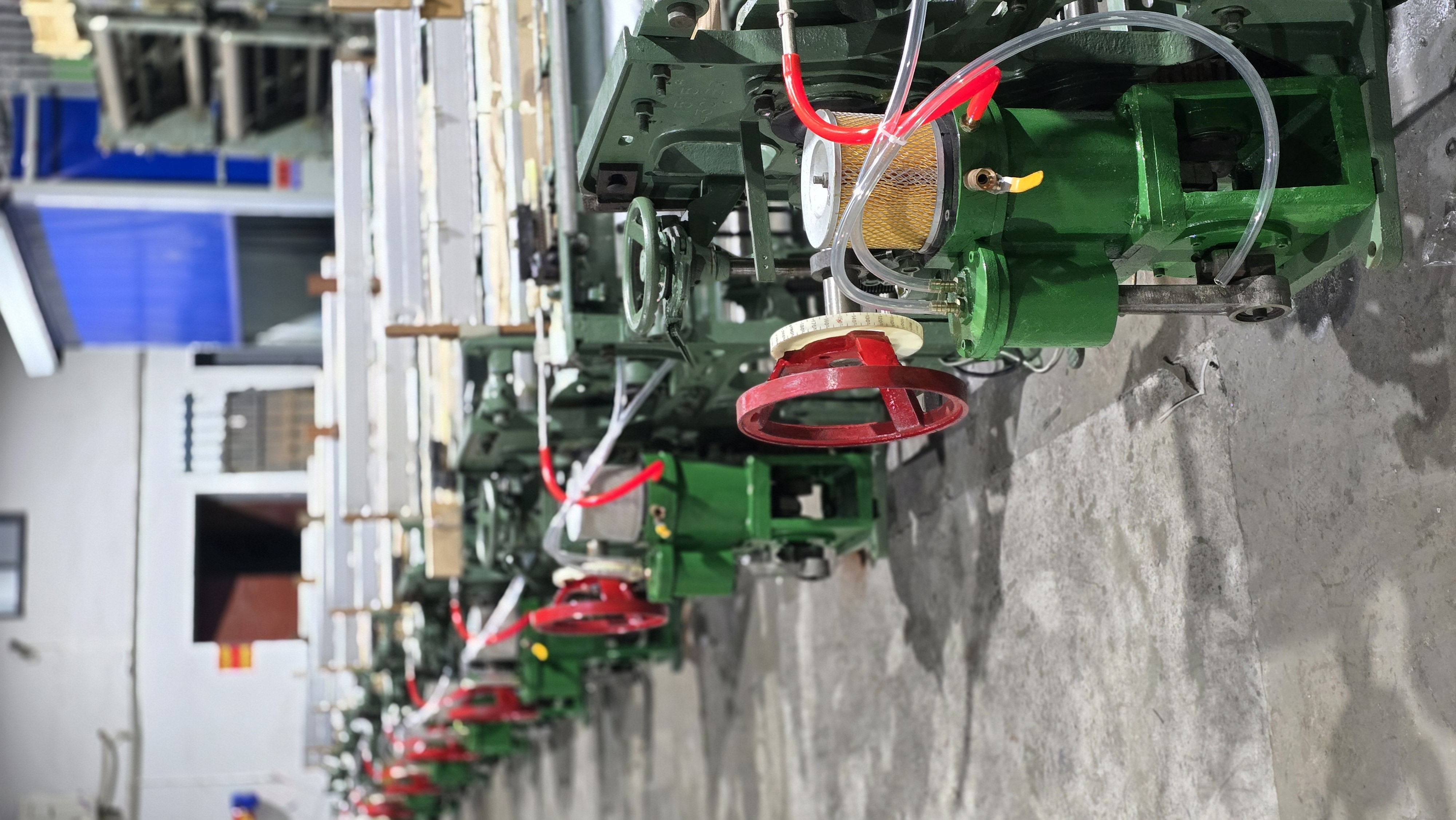 Side view of MG768 machines in production workshop